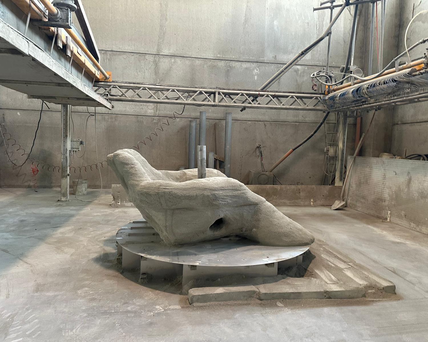The raw concrete sculpture inside the D-Shape facility